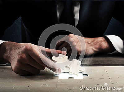 Complete a puzzle Stock Photo