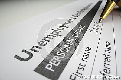 Completing unemployment benefits application form Stock Photo