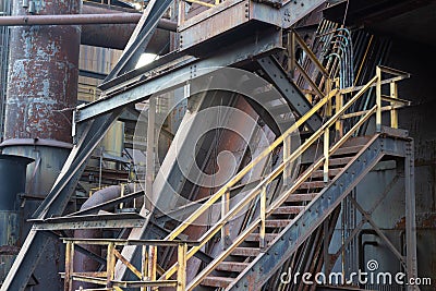 Complex industrial site with stairs and pipes,heavily textured paint and rust patinas Stock Photo