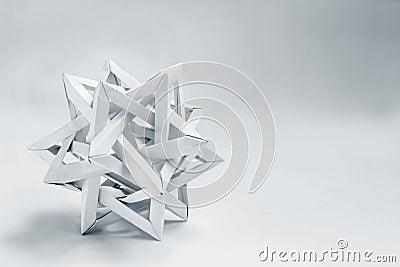 Complex tetraeder folded paper origami on a white background Stock Photo