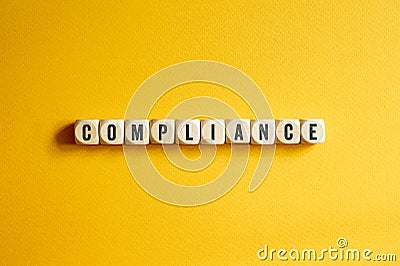 Compliance - word concept on building blocks, text Stock Photo