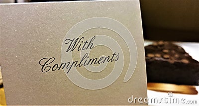 A With Compliments note in a hotel Stock Photo
