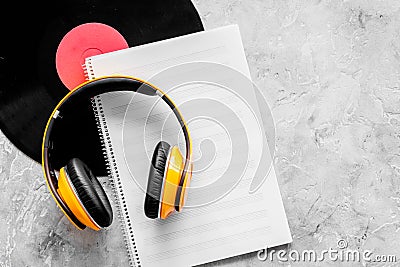 Compose music. Vinyl records, headphones, music notes on grey background top view copyspace Stock Photo