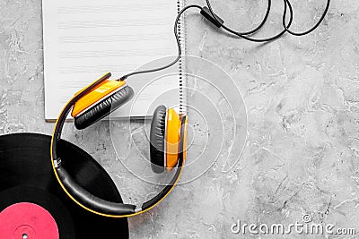 Compose music. Vinyl records, headphones, music notes on grey background top view copyspace Stock Photo