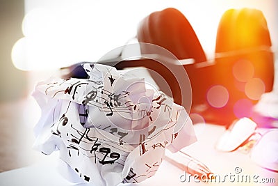 Composing music concept with shallow DOF evenly matched crumpled Stock Photo