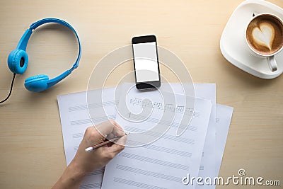 composing music note top view with hand writing coffee and blue Stock Photo