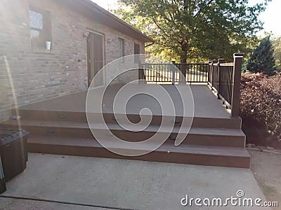 Composite deck with pecan decking and mocha railing Stock Photo