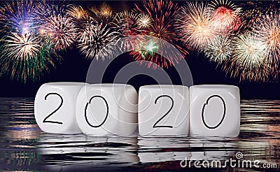 Composite of fireworks and calendar for 2020 New Year holiday background Stock Photo