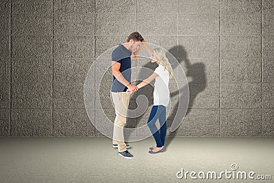 Composite image of angry man overpowering his girlfriend Stock Photo