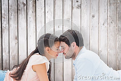 Composite image of attractive young couple smiling at each other Stock Photo