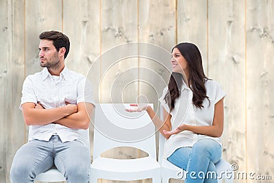 Composite image of brunette pleading with angry boyfriend Stock Photo