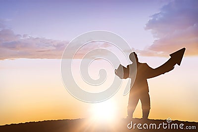 Composite image of businessman with arrow Stock Photo