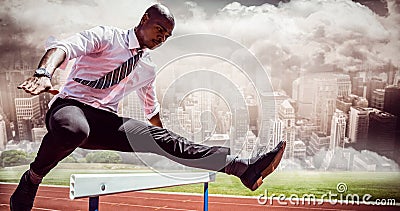 Composite image of businessman jumping a hurdle Stock Photo