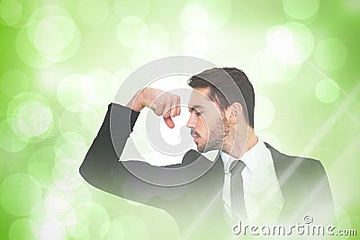 Composite image of cheerful businessman tensing arm muscle Stock Photo