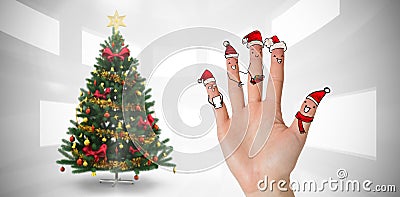 Composite image of christmas caroler fingers Stock Photo