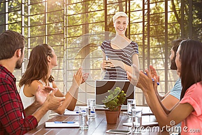Composite image of colleagues clapping hands in a meeting Stock Photo