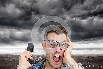 Composite image of computer engineer screaming while on call in front of open cpu Stock Photo