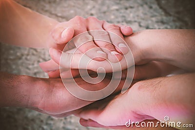 Composite image of cropped image of people forming hands stack Stock Photo