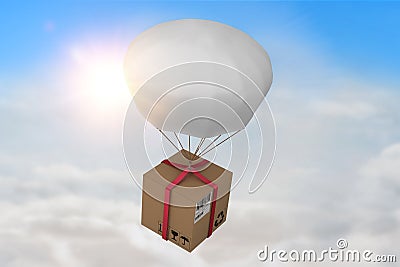 Composite image of 3d composite image of parachute carrying cardboard box Stock Photo