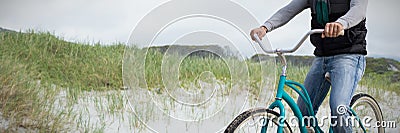 Composite image of digital composite of handsome man on a bike ride Stock Photo