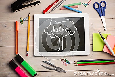 Composite image of digital tablet on students desk Stock Photo