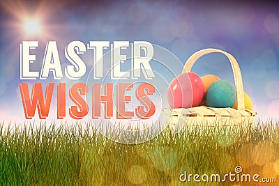 Composite image of easter eggs in wicker basket Stock Photo