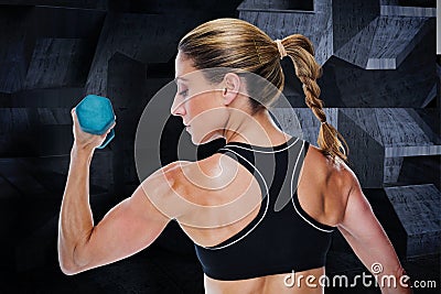 Composite image of female bodybuilder holding a dumbbell Stock Photo