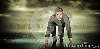 Composite image of focused businessman ready to race Stock Photo