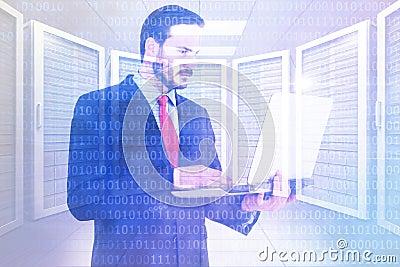 Composite image of focused businessman using his laptop Stock Photo