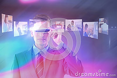 Composite image of handsome businessman virtual reality glasses Stock Photo