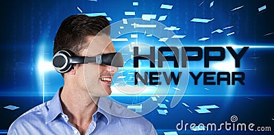 Composite image of happy handsome man with virtual reality simulator Stock Photo