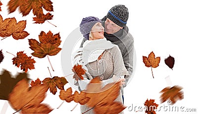 Composite image of happy mature couple in winter clothes embracing Stock Photo