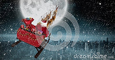 Composite image of high angle view of santa claus riding on sled during christmas Stock Photo