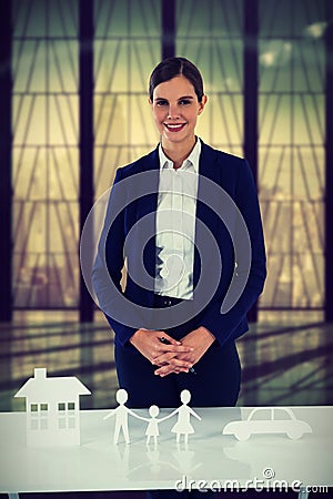 Composite image of insurer with different property to insure Stock Photo