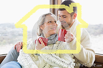 Composite image of loving couple in winter wear drinking coffee against window Stock Photo