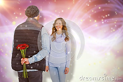 Composite image of man hiding roses behind back from woman Stock Photo
