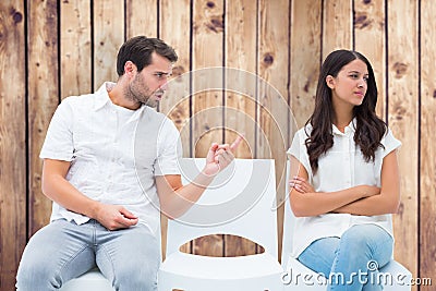 Composite image of man pleading with angry girlfriend Stock Photo