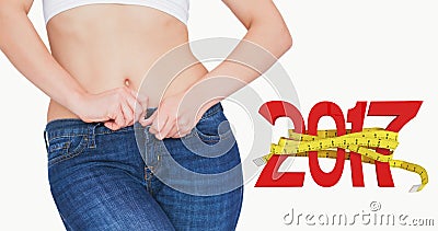 Composite image of midsection of slim woman buttoning jeans Stock Photo