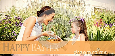 Composite image of mother and daughter collecting easter eggs Stock Photo