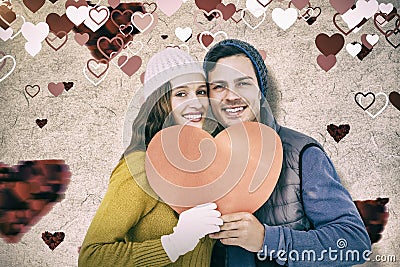 Composite image of portarit of happy couple holding paper heart Stock Photo