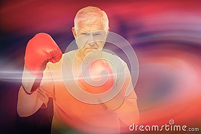 Composite image of portrait of a determined senior boxer Stock Photo