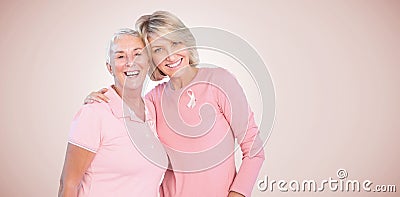 Composite image of portrait of happy daughter with mother supporting breast cancer awareness Stock Photo