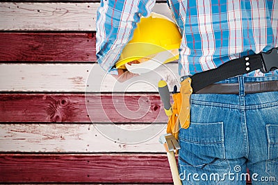 Composite image of rear view of handyman wearing tool belt Stock Photo