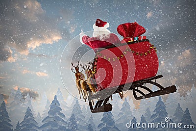 Composite image of santa claus riding on sled with gift box Stock Photo