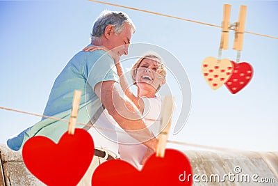 Composite image of senior woman hugging her partner Stock Photo