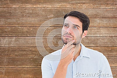 Composite image of serious thinking man looking up Stock Photo