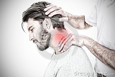 Composite image of side view of a man getting the neck adjustment done Stock Photo