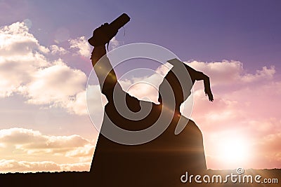 Composite image of silhouette of graduate Stock Photo