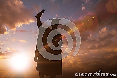 Composite image of silhouette of graduate Stock Photo