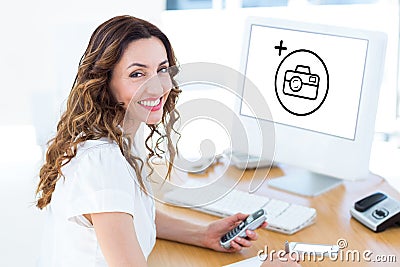 Composite image of smiling businesswoman looking at camera Stock Photo